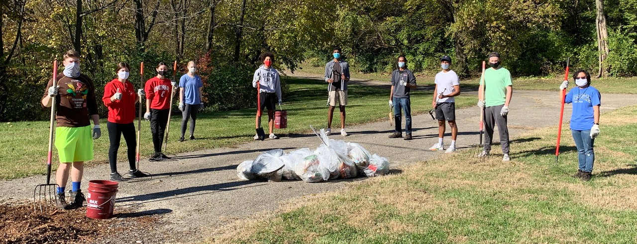 10 masked volunteers clean Coy Field