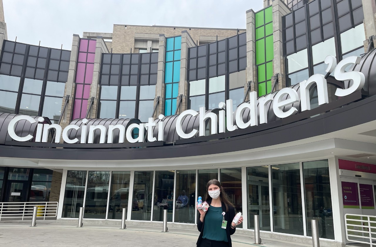 Kylie stands in front of Cincinnati Children's Medical Center Hospital