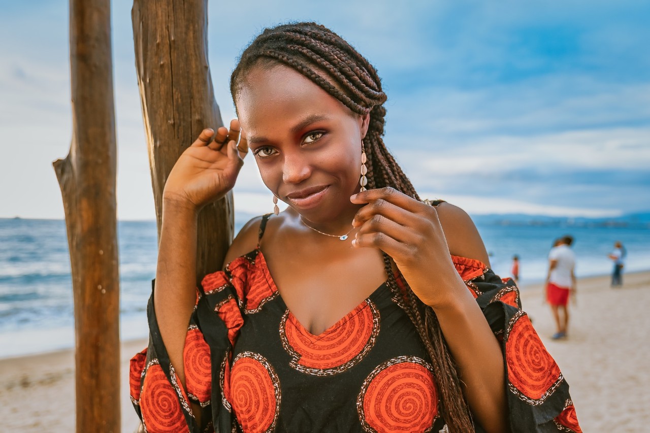 black woman walking along the beach