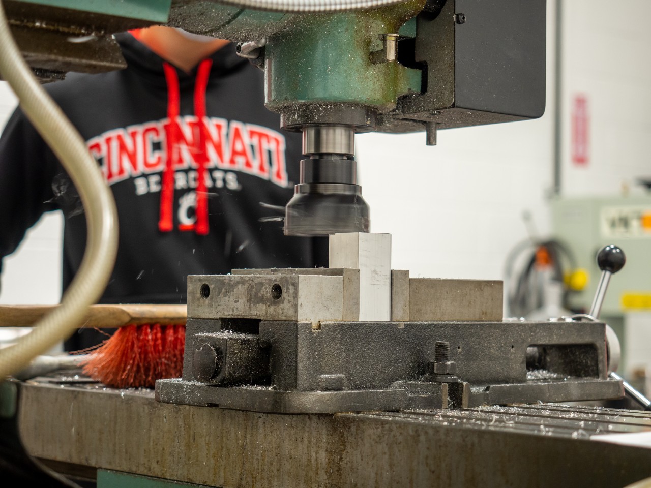 student working with machine