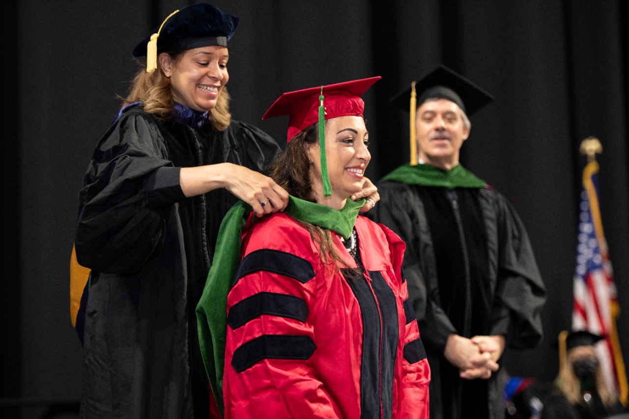 Dr. Mia Mallory hoods Hagar Elgendy at Honors Day.