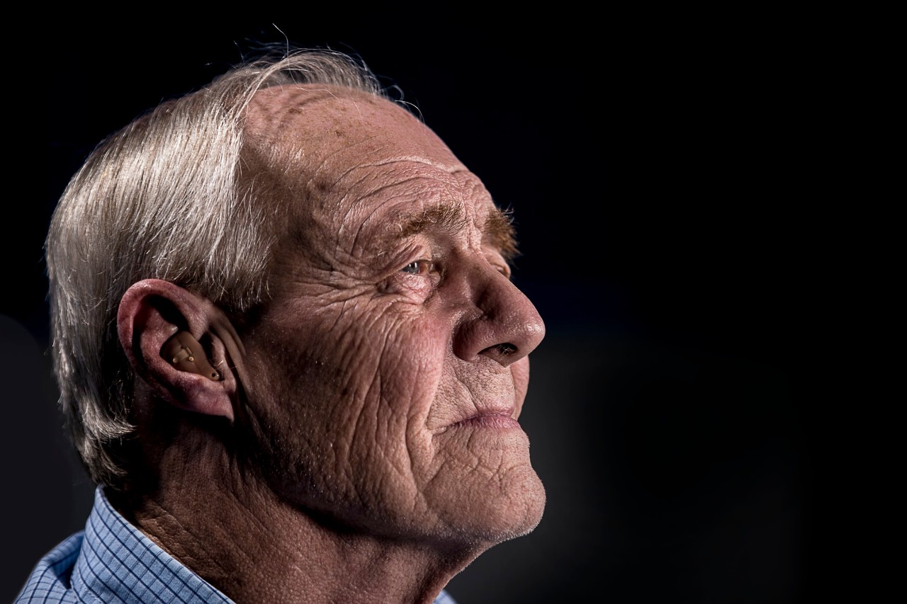 older man with a hearing aid