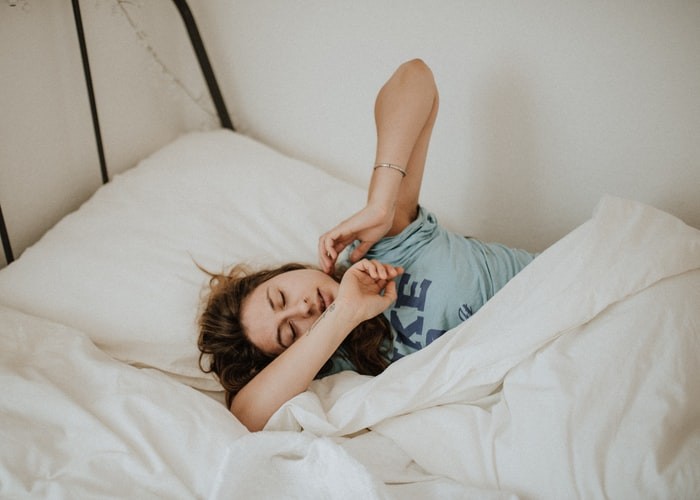 a woman sleeping on a pillow