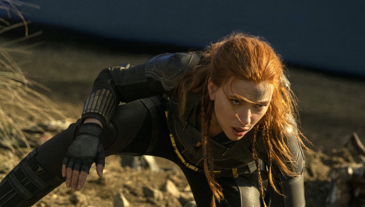 Scarlett Johansson crouches as Black Widow in a still from the movie.