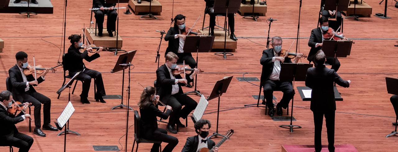 Musicians  perform on stage during a concert