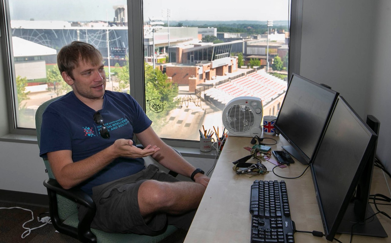 Dieter Vanderelst sits in his office.