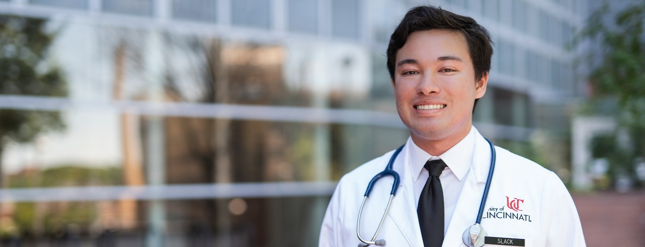male medical student in white coat