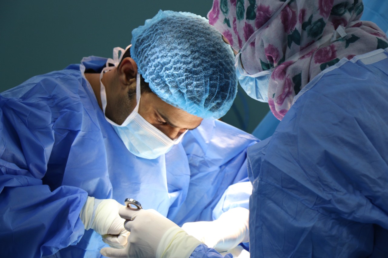 surgeons performing a surgery