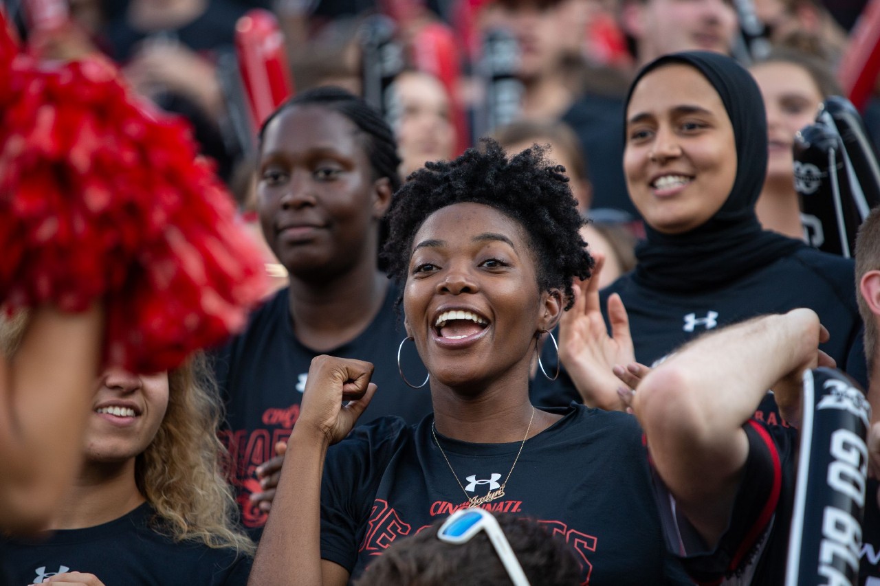 Students cheer at a football game