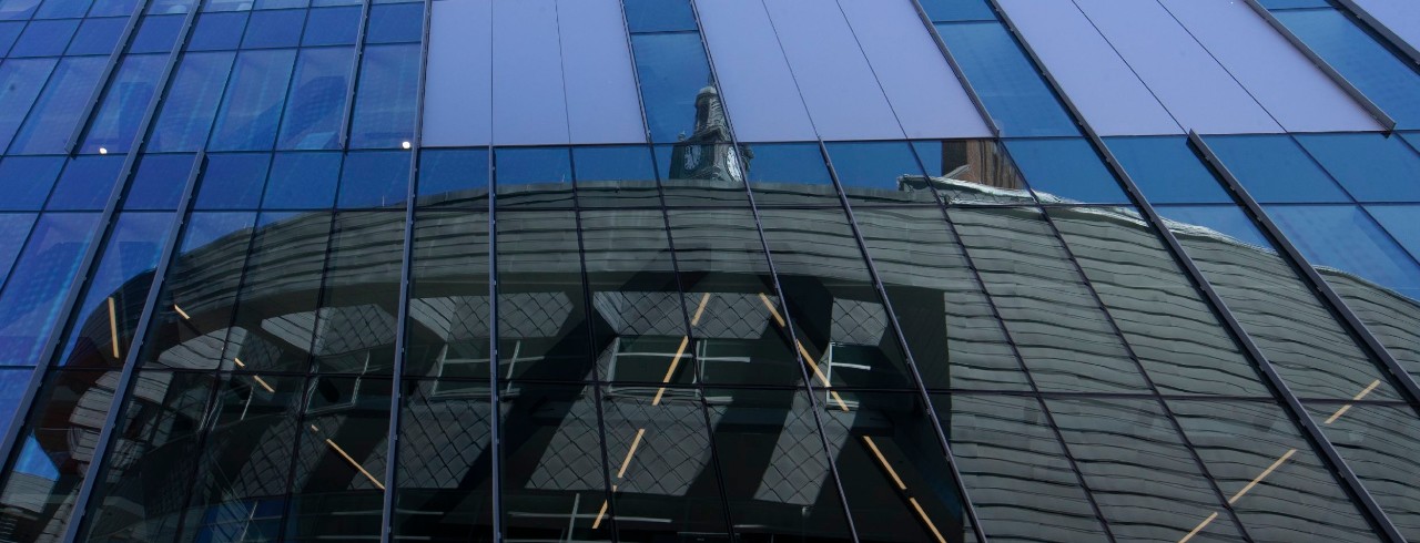 Campus building in window reflection