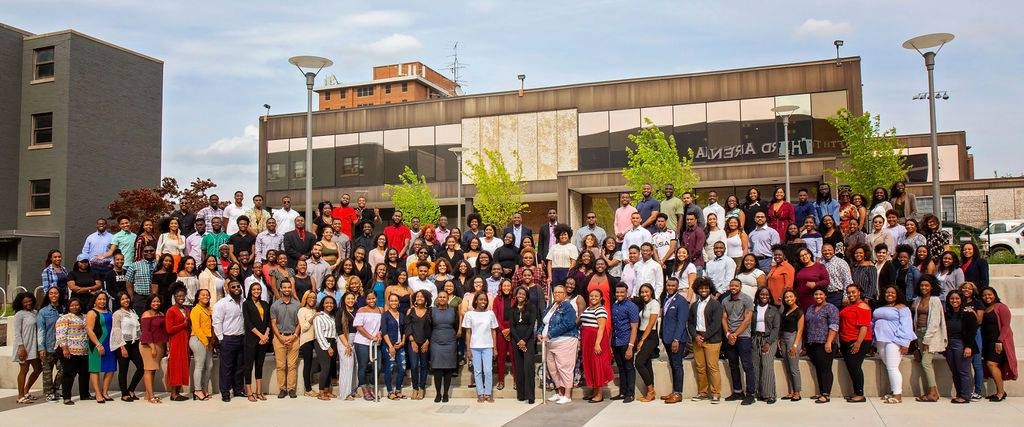 UC community members show their support for the AACRC and pose in front of the structure.