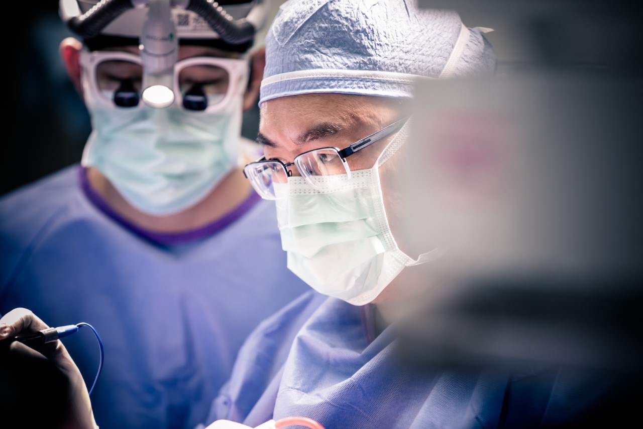Two surgeons work in an operating room