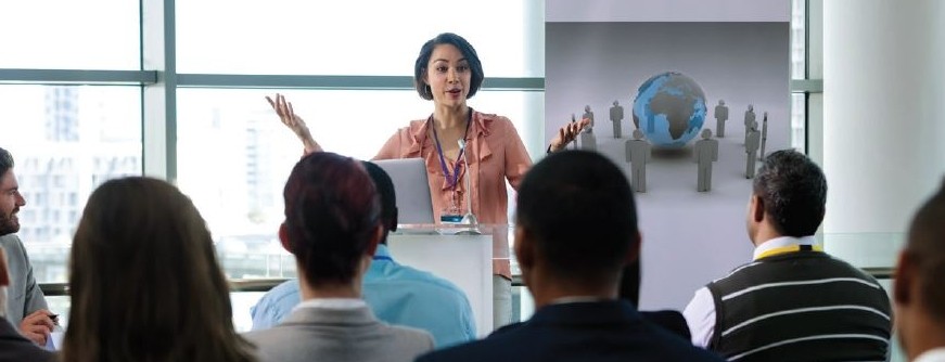 Female instructor in front of class