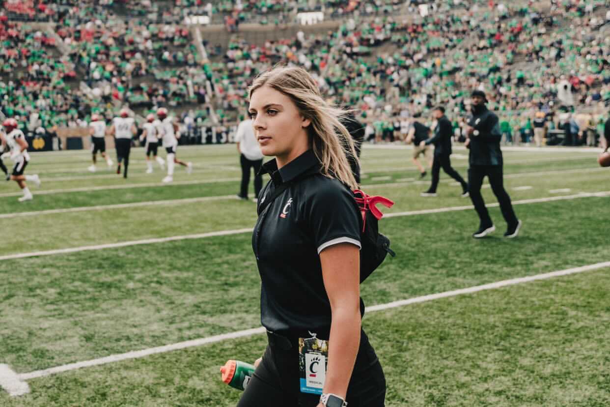 Hannah on the field at the UC vs Notre Dame football game