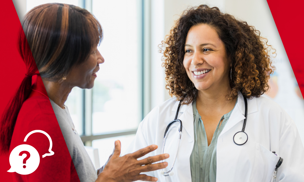 Female nurse talking with female patient