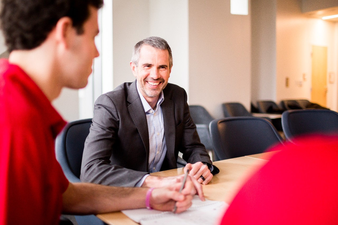 Man sits at table.