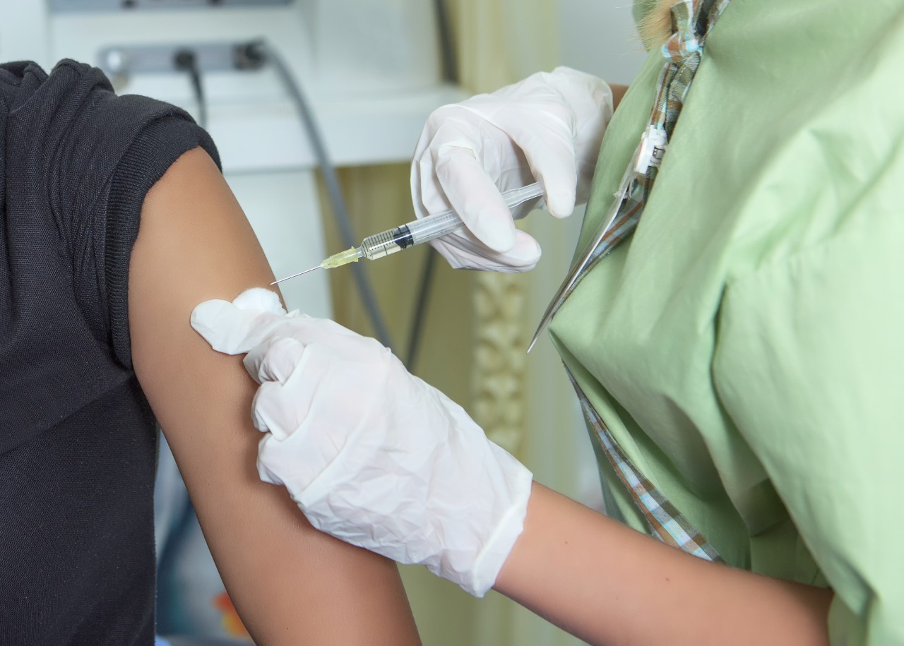Picture of a person receiving a vaccination in their arm 