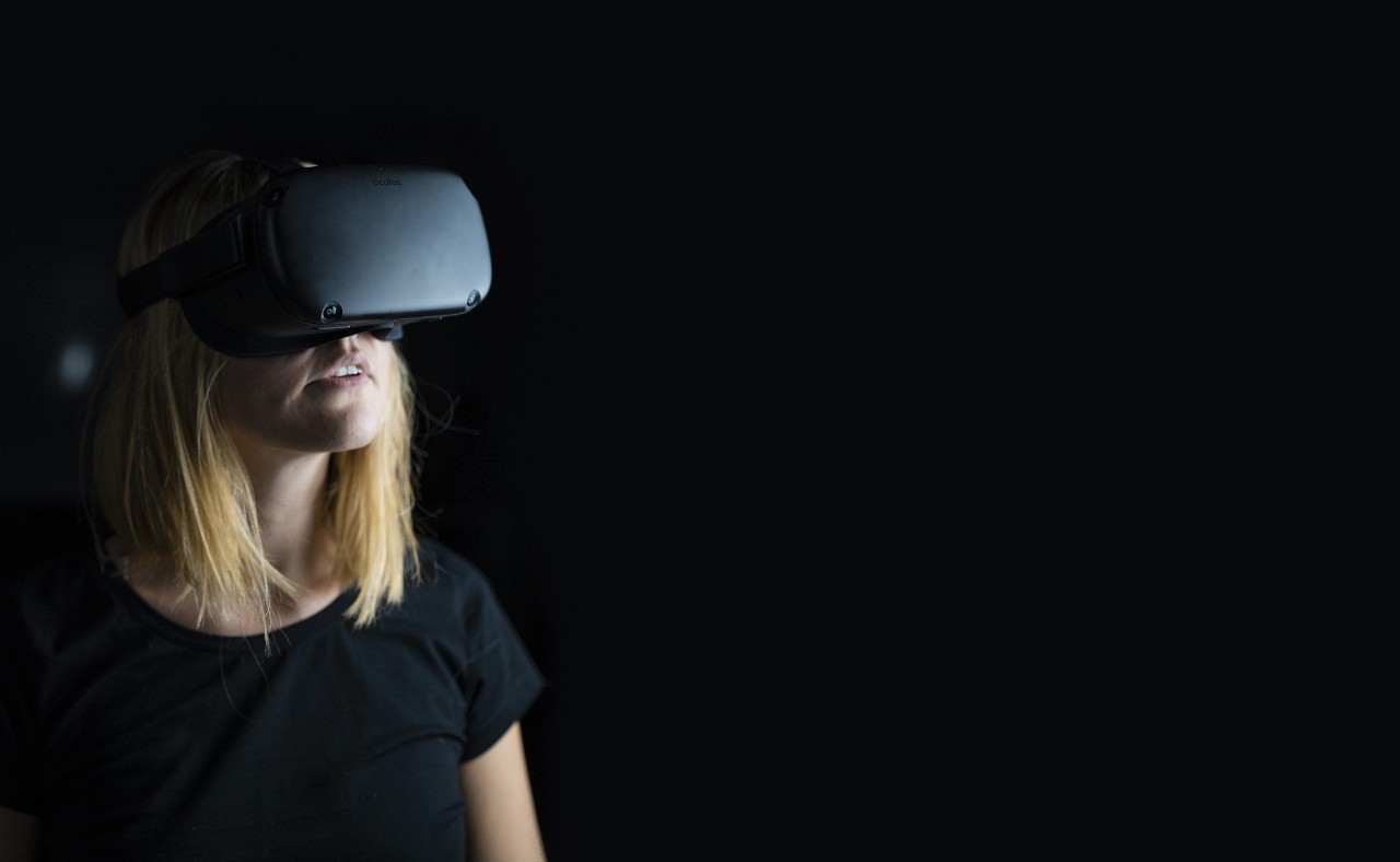 image with a female wearing virtual reality goggles