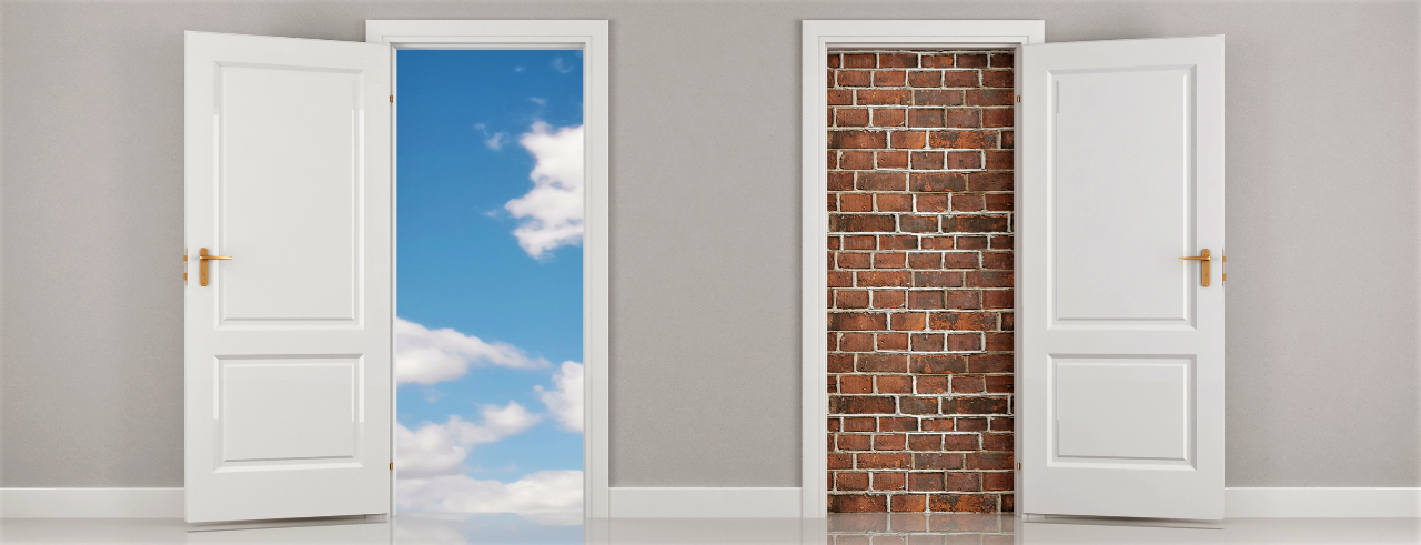 two open doors. One has a blue sky beyond it. The other has a brick wall.