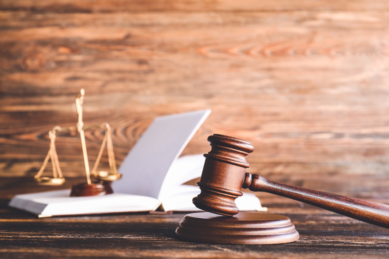 Judge's gavel on wooden background