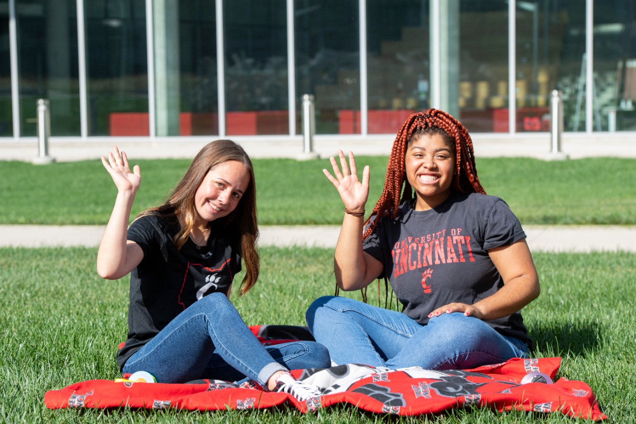 Students sitting on lawn 