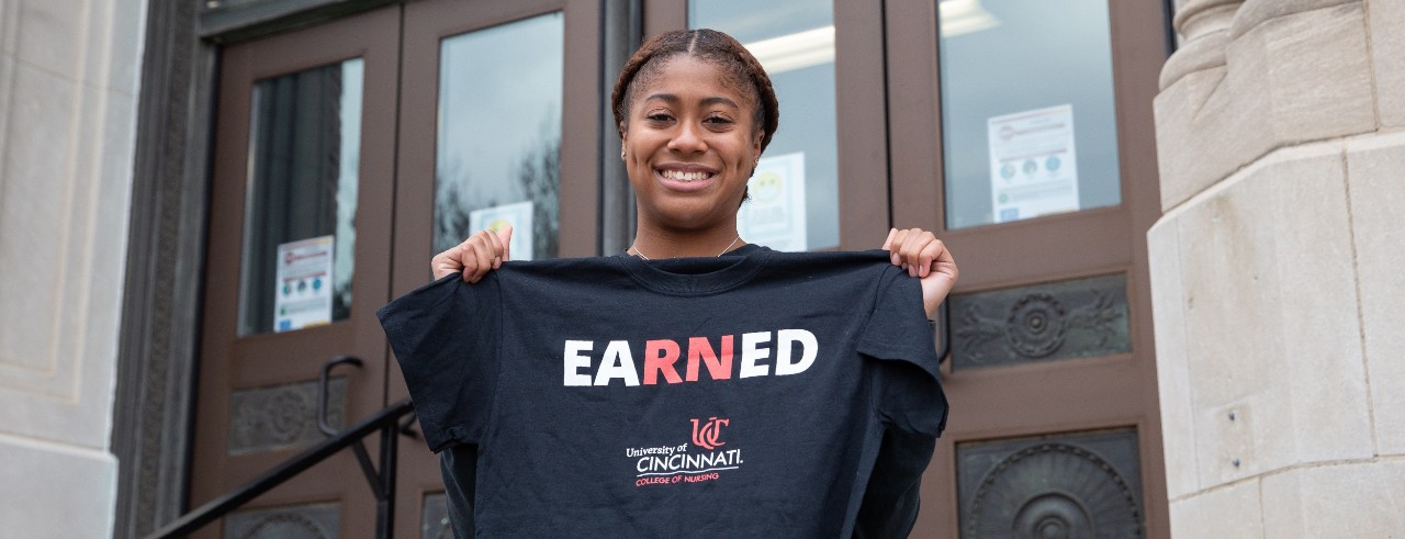 Girl holding T-shirt