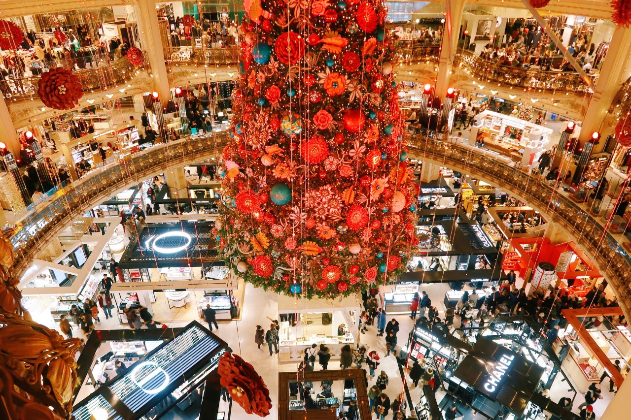 overhead view of luxury shopping mall at Christmas time with large tree 