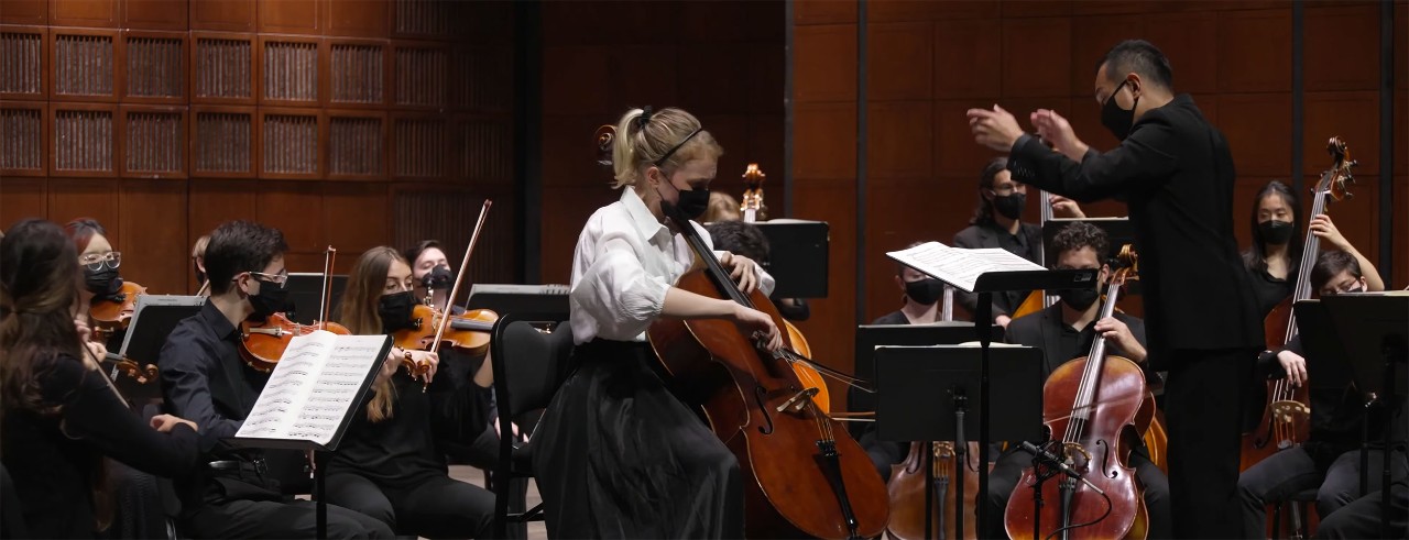 An orchestra performing on stage