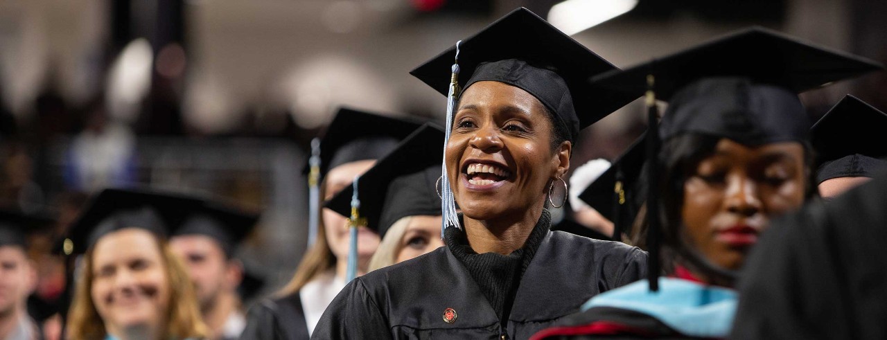 Graduates smile at Fifth Third Arena.