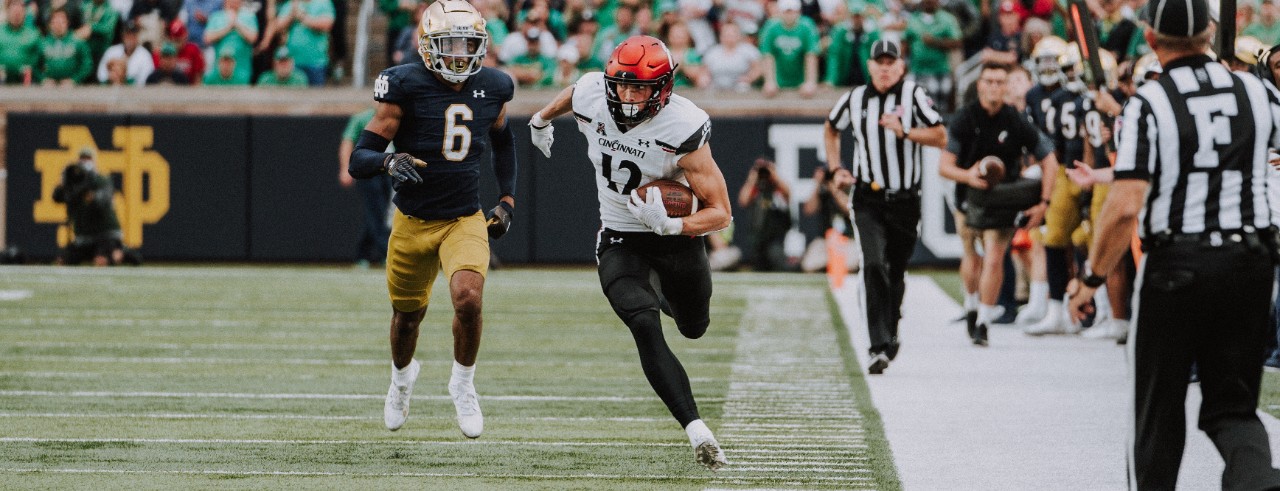 Alec Pierce runs down the sideline after a catch at a football game against Notre Dame 