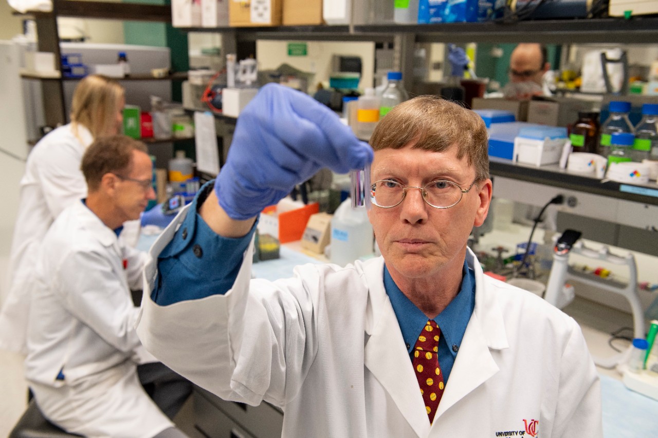 University of Cincinnati professor Andrew Norman works in his lab.