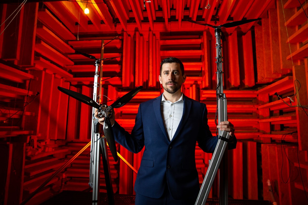 UC professor Daniel Cuppoletti holds a drone propellor in an anechoic chamber.