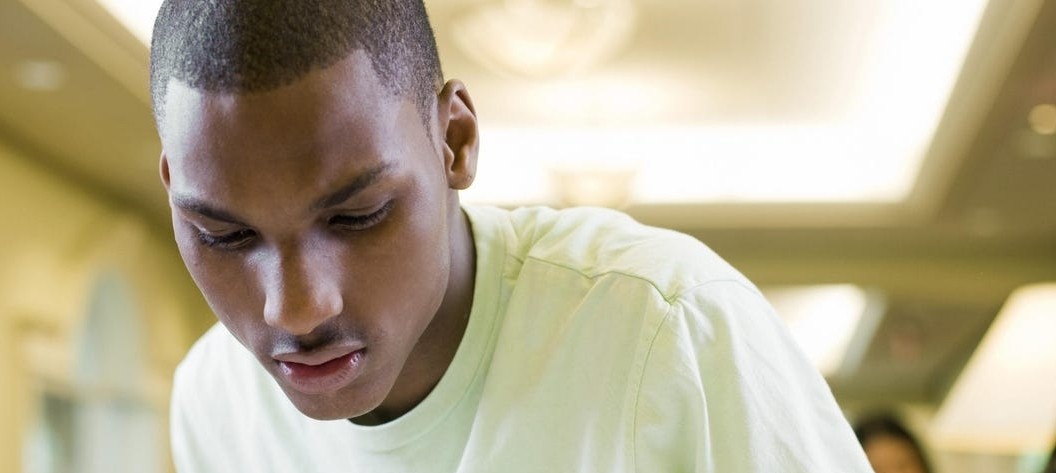 young black male studying