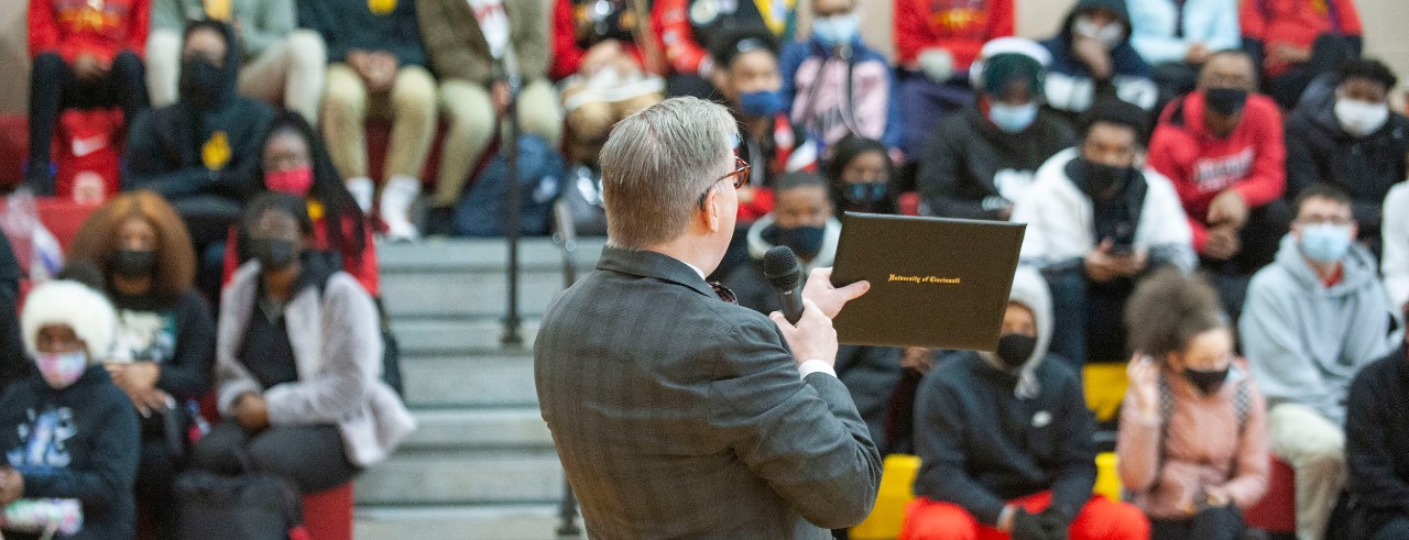 Jack Miner addresses a crowd in a gym