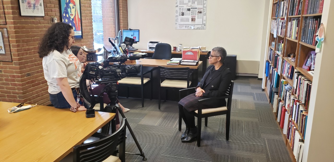 Dean Verna Williams interviewed by Local 12 News crew.