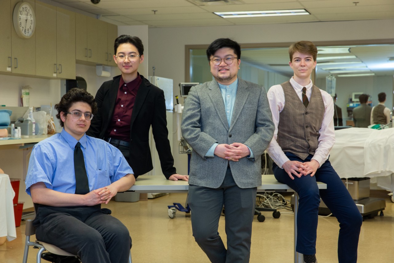 Four medical students in a college of medicine lab