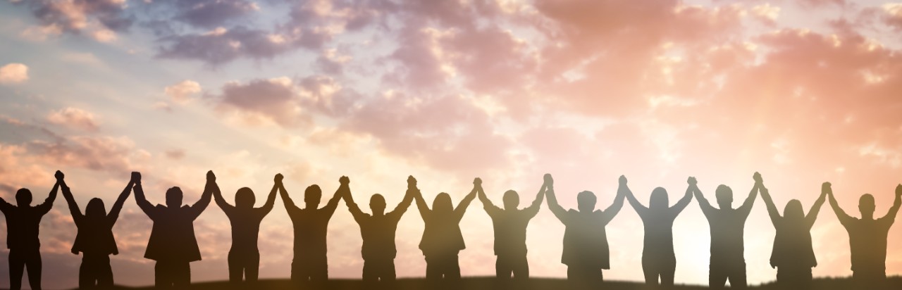 people holding hands in a line