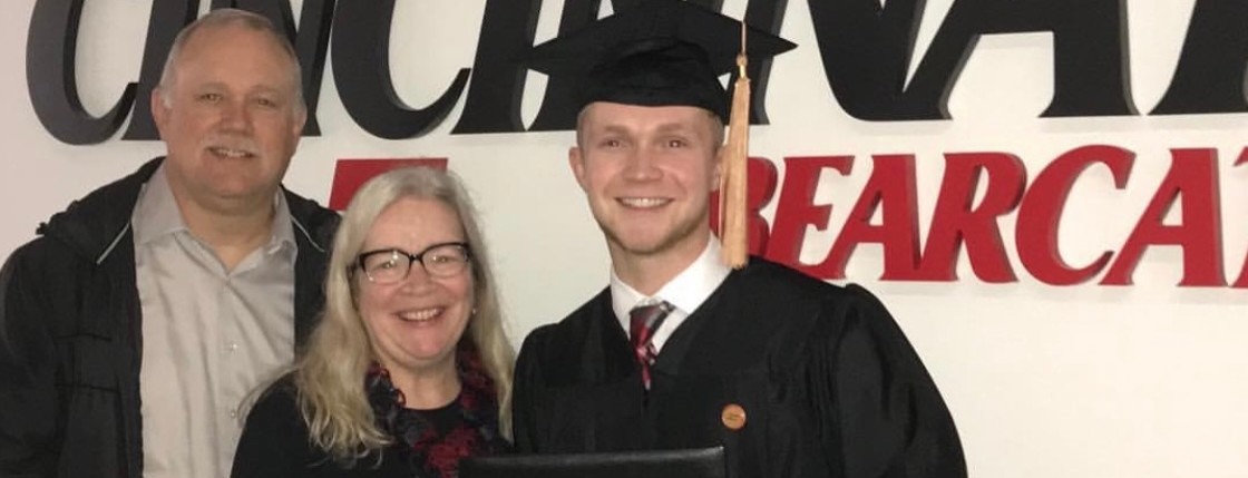 John Eringman with his parents at his UC graduation.
