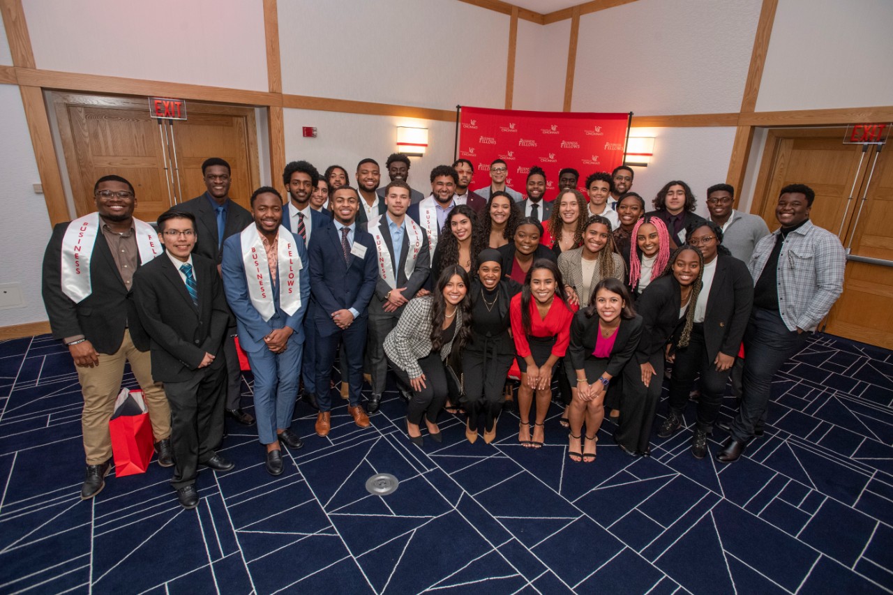 A group of students pose for a picture at an awards ceremony.