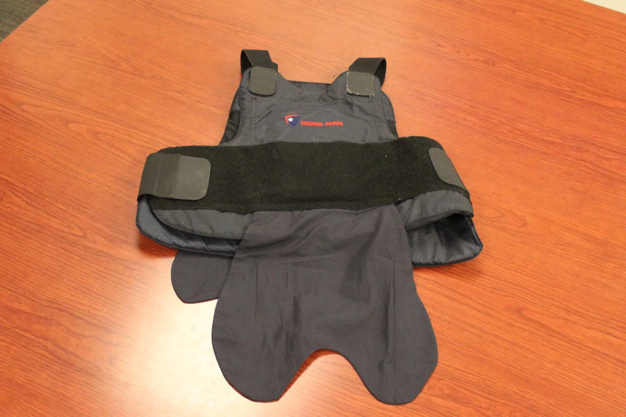 A vest laying on a table.