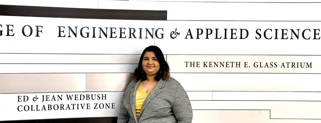 Jutshi Agarwal poses in front of a College of Engineering sign.