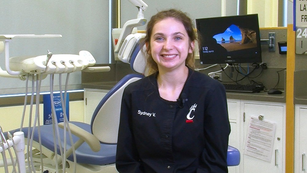 Sydney Velazco poses in a dental office.