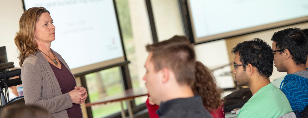 woman in classroom teaching students