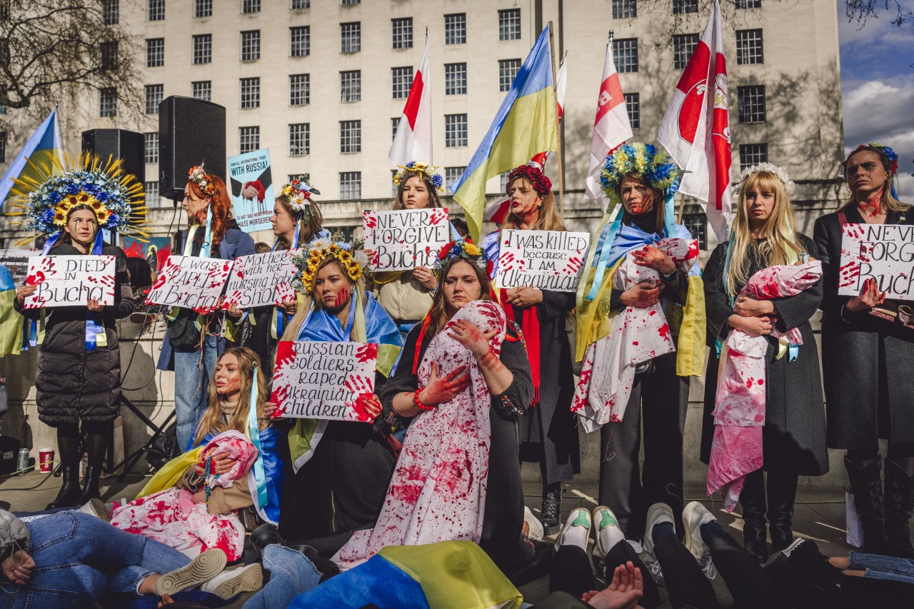 Protests demonstrate against Ukraine invasion by Russia with signs