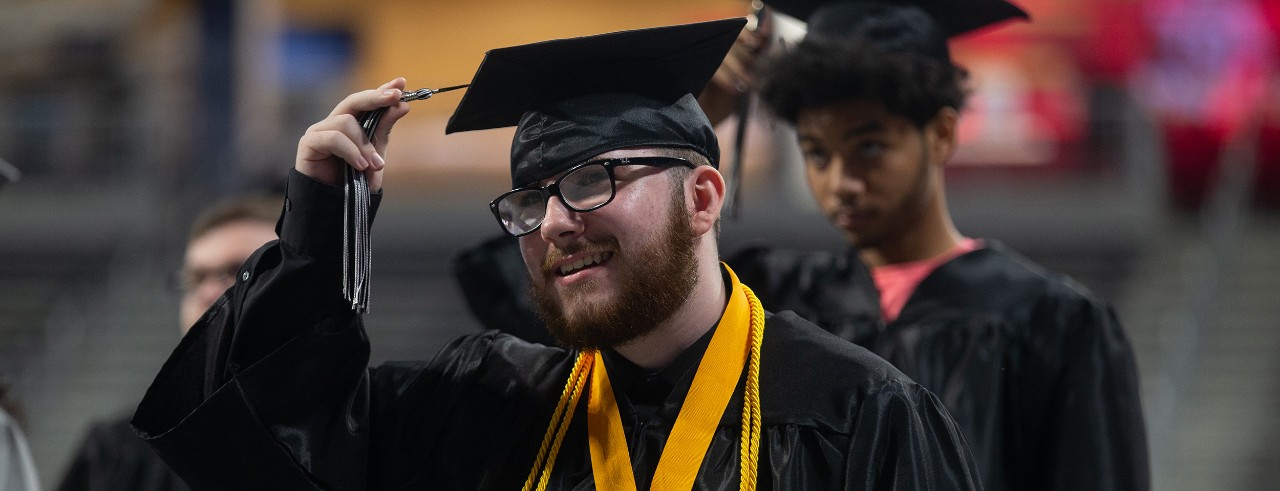 Marcus Elliott in his cap and gown at Oyler graduation