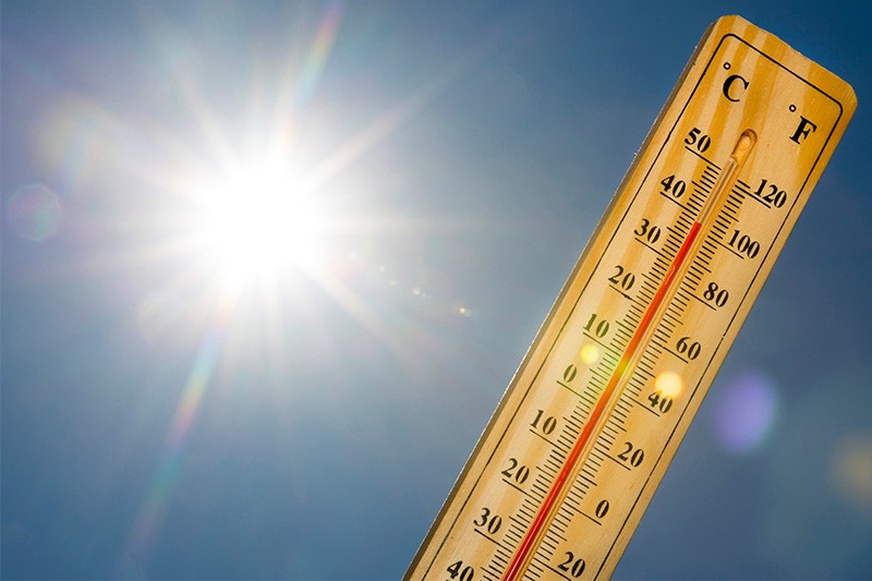 a photo of the sun with a thermometer showing high temperatures