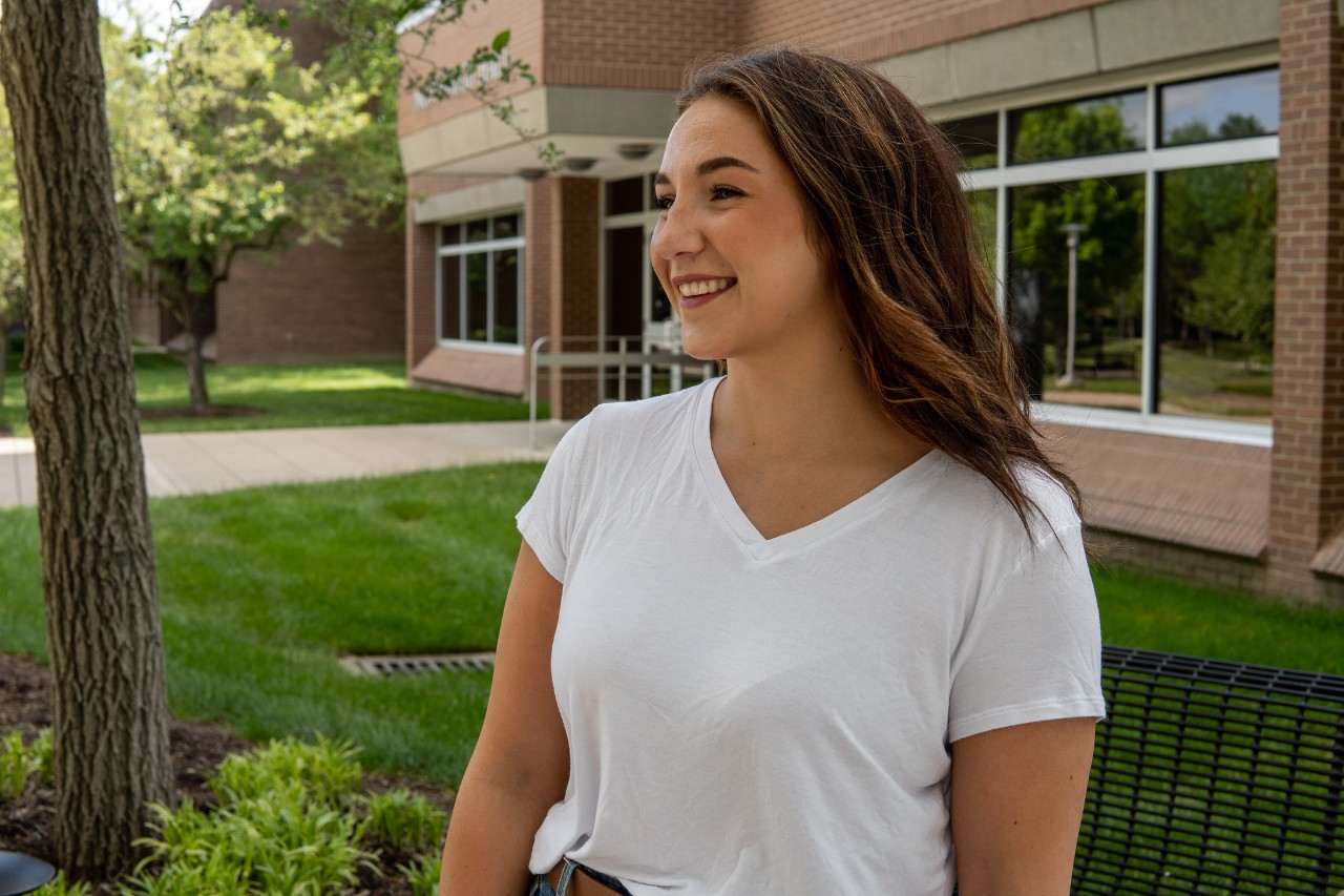 profile of student smiling on campus