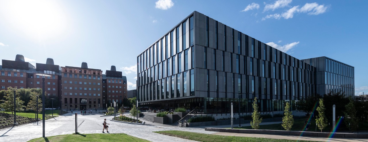 southeast corner view of exterior of Lindner Hall on sunny day with engineering building in background