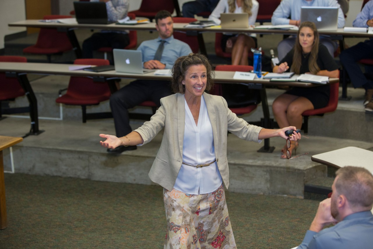 Professor Janet Moore engages with students.