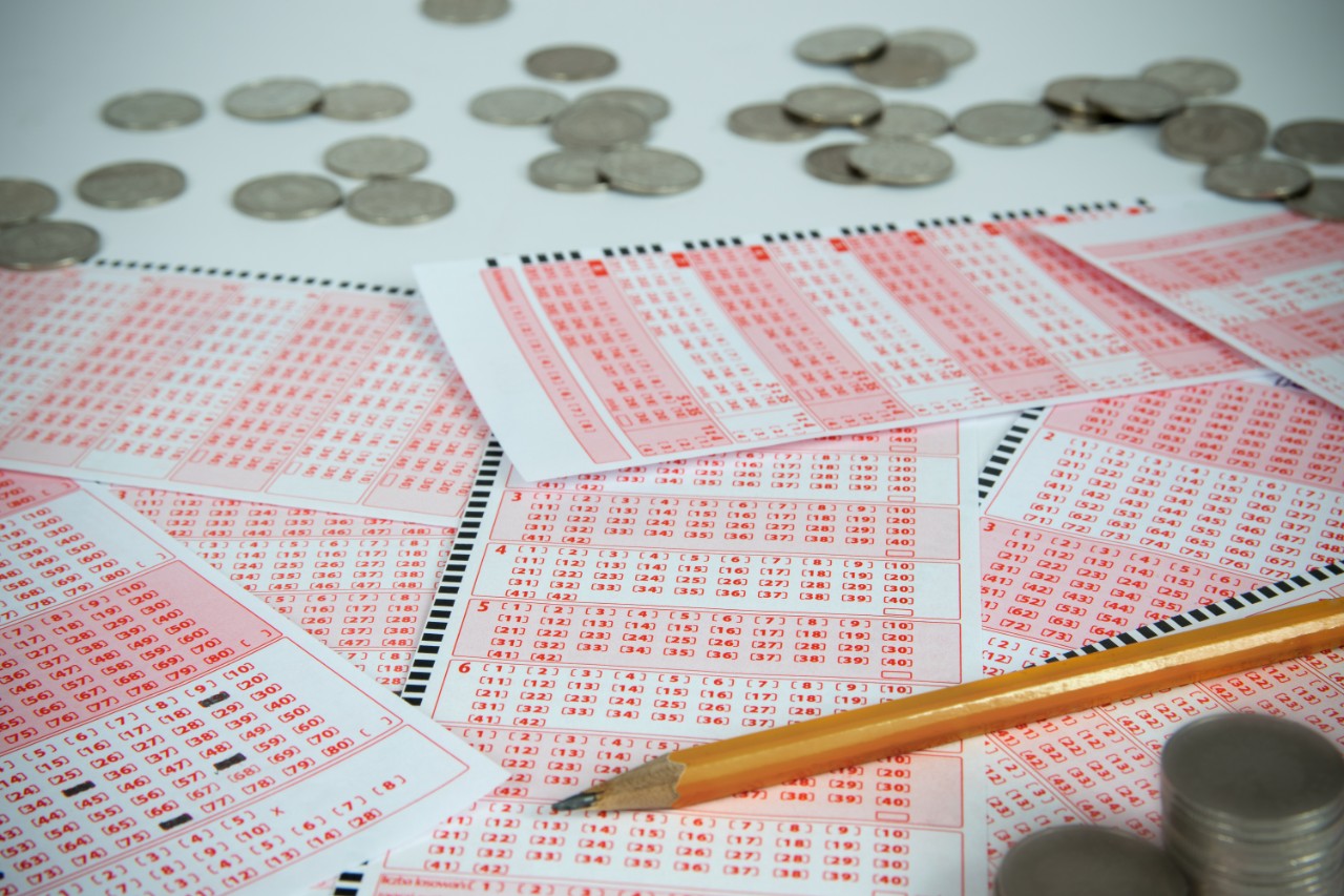 Scene with lottery tickets, pencil and money. Chance to win.